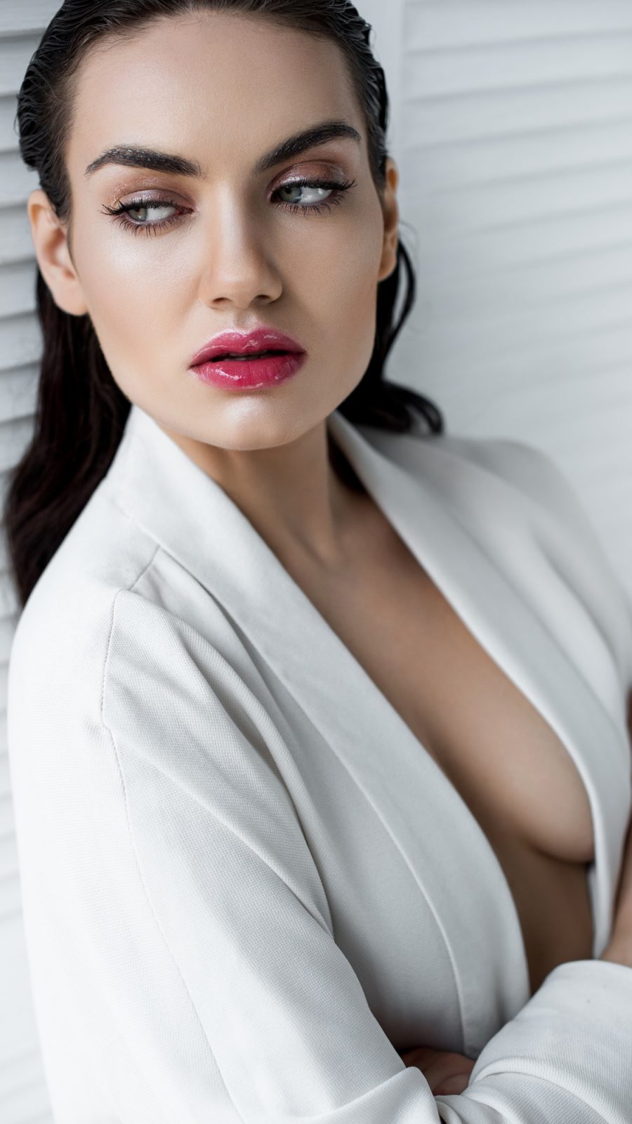 attractive sexy woman posing in white fashionable jacket
